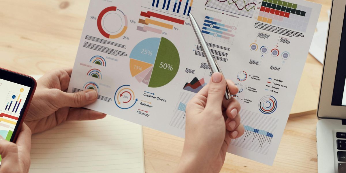 A team collaborates to analyze data insights, reflecting the importance of learning analytics for better outcomes.