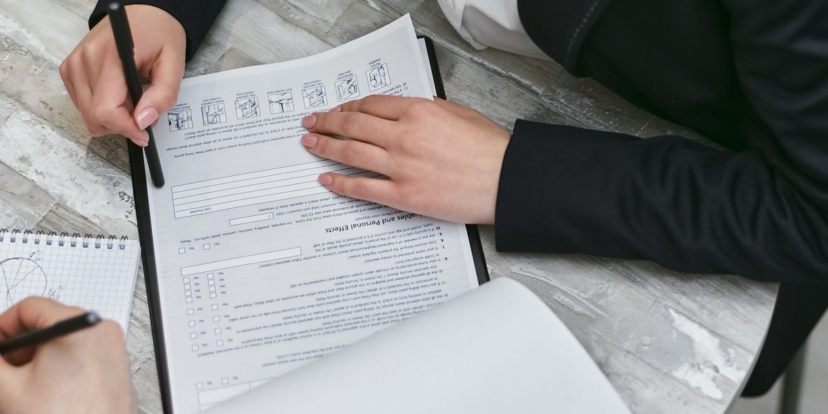 A professional meticulously reviewing documents, symbolizing the thorough evaluation process for AI tools.