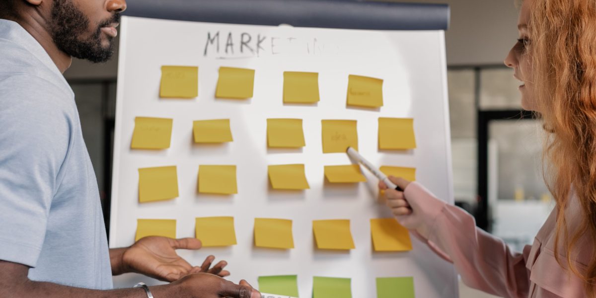 A diverse marketing team collaborating, sharing ideas, and brainstorming in a vibrant office setting, symbolizing the creative opportunities AI writing brings.