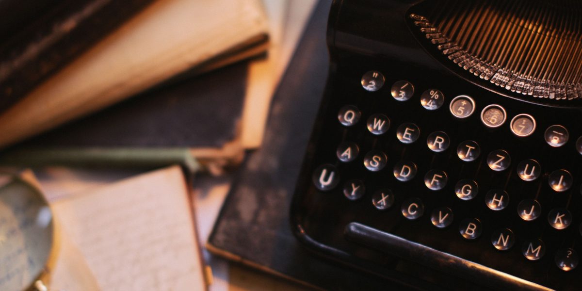 A person focused on editing a manuscript, symbolizing the human touch needed to refine AI-generated content.
