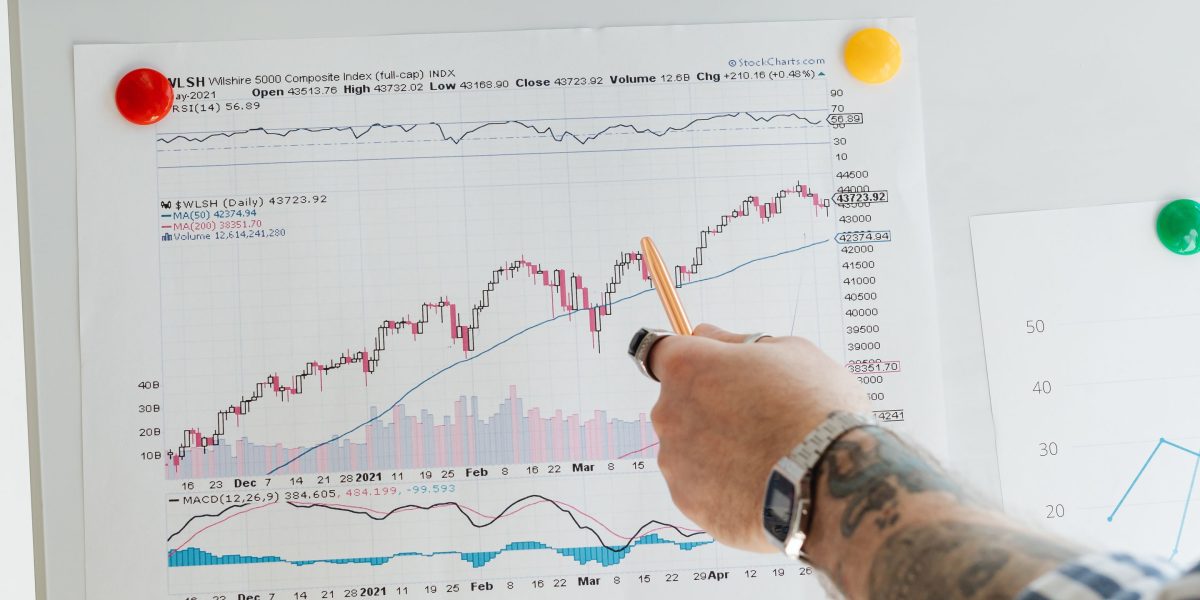 A person organizing various information sources on a whiteboard, illustrating a structured approach to consuming news.