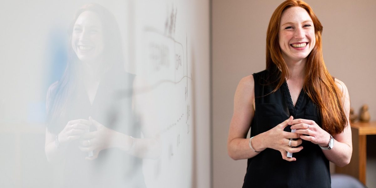 A professional outlines strategic steps on a whiteboard, emphasizing a structured approach to investment.