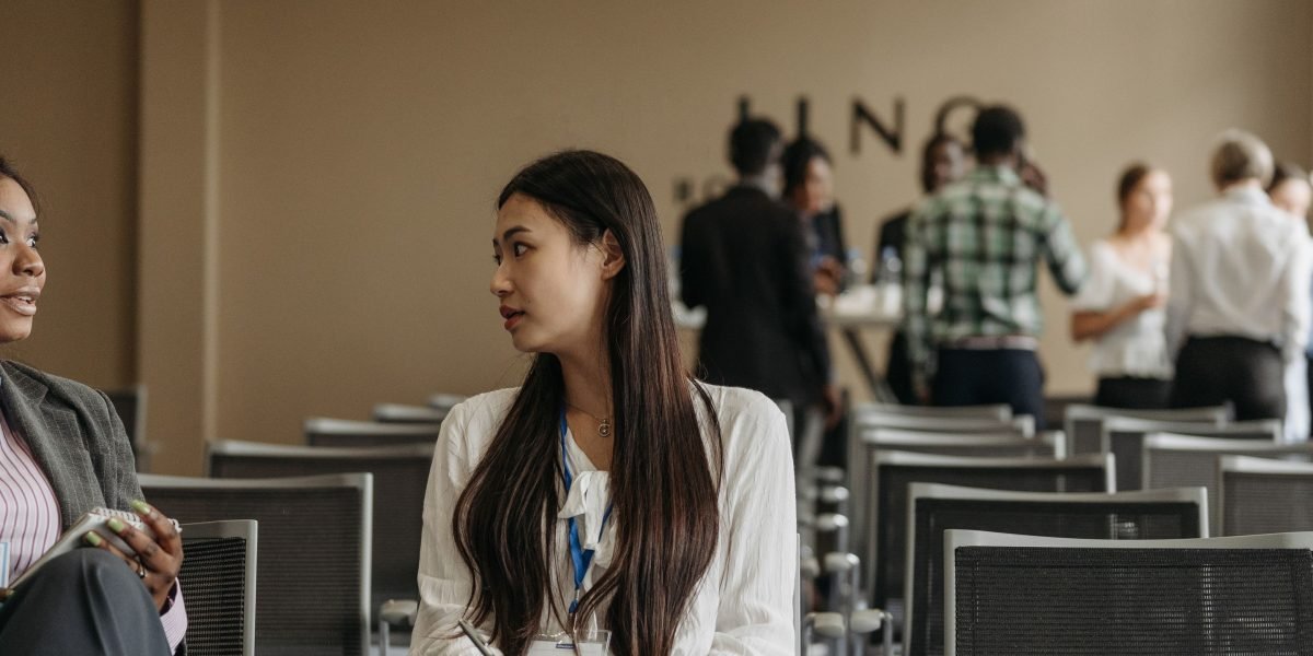 Professionals engage in a networking event, making connections that could lead to crucial funding opportunities.