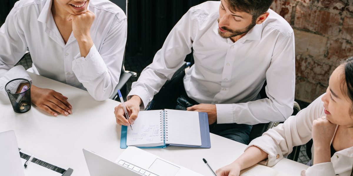 A team collaborating, perhaps analyzing data or discussing strategies, reflecting the role of AI in modern VC evaluations.