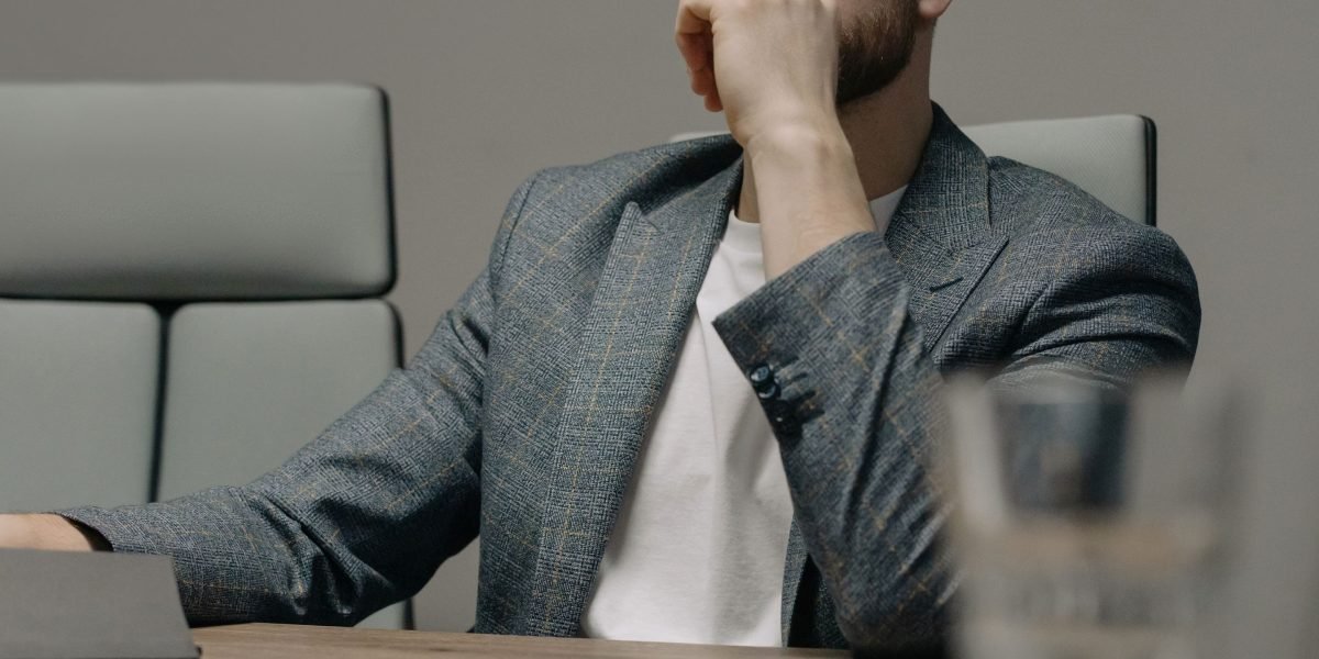 A leader deep in thought, considering crucial strategic decisions for their venture's future.