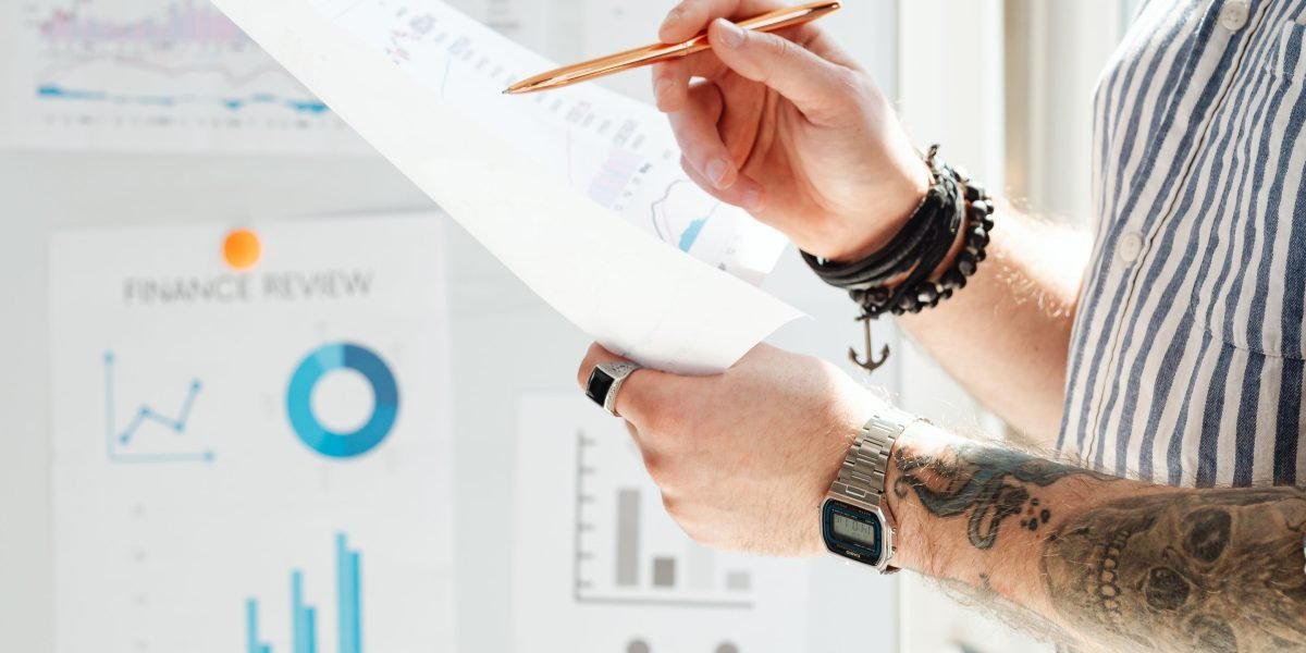 An investor thoughtfully analyzing market data and reports, searching for signals of promising AI companies.