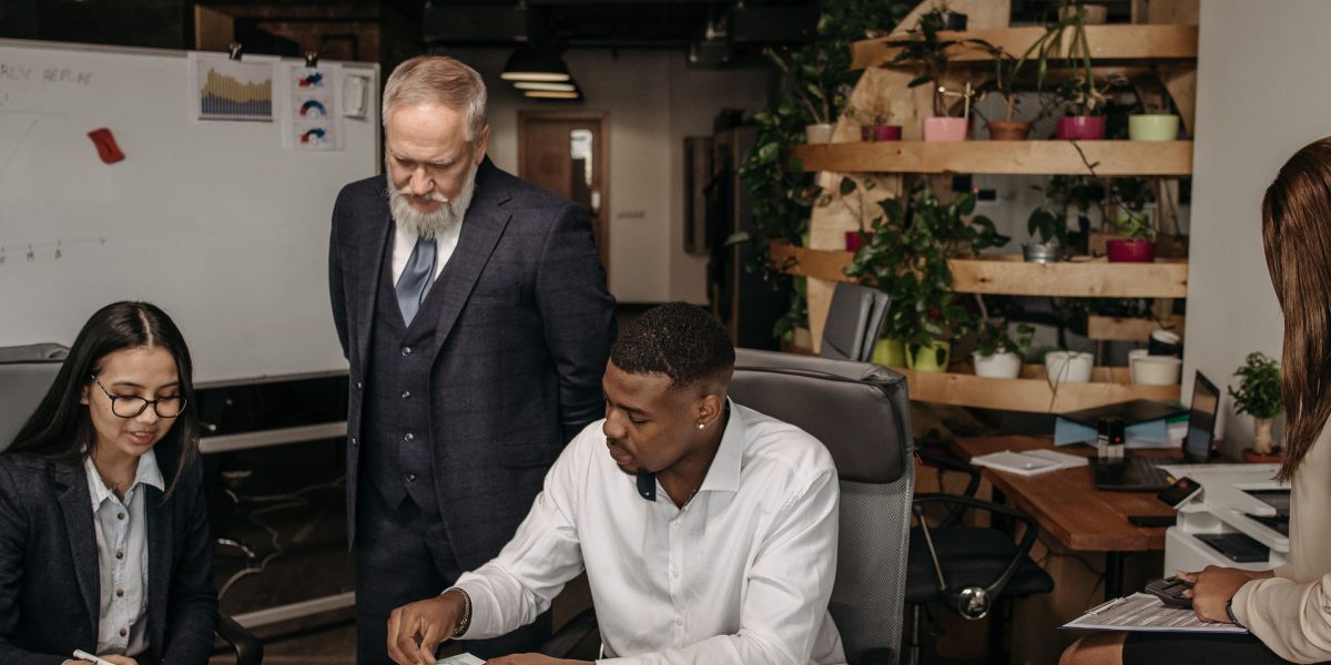 A diverse team collaborating in a modern office, symbolizing widespread AI adoption across businesses.