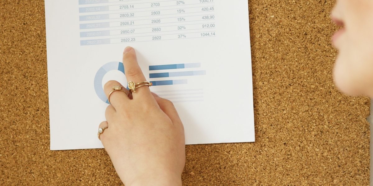 A person diligently reviewing and processing complex data, reflecting the challenge of navigating vast AI investment information.
