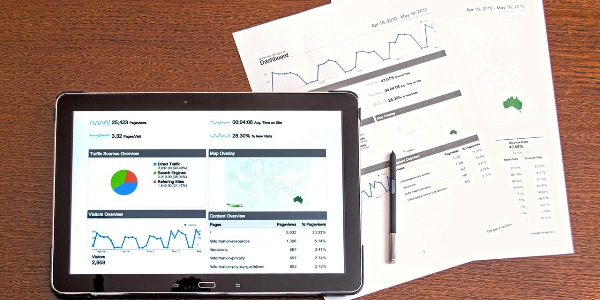 Investment professionals review financial reports and market trends, reflecting the analytical work involved in understanding major firms like Starwood Capital Group.