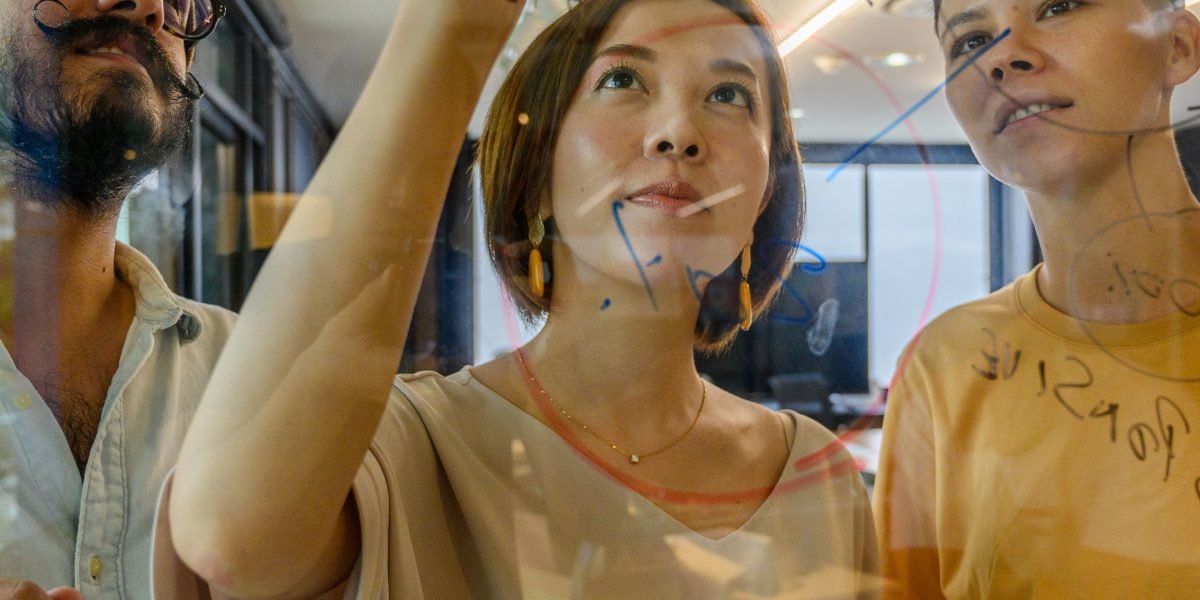 A diverse team collaborates, ideating innovative solutions that could attract venture capital.