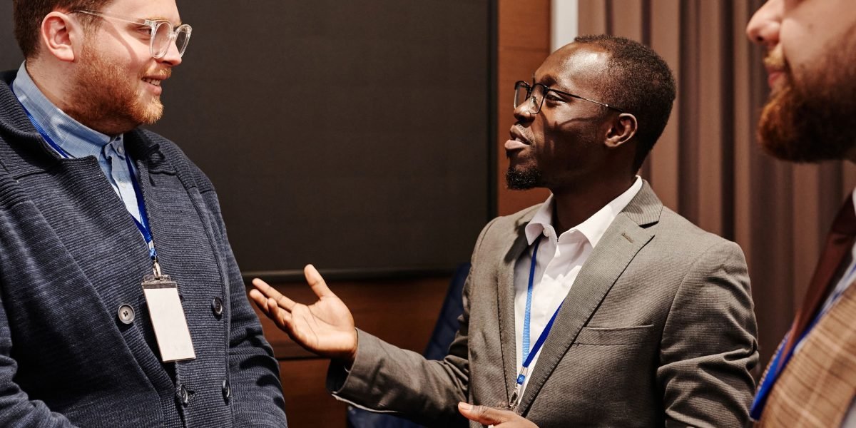 Business leaders engaging in a discussion, symbolizing the importance of a professional image for investors and partners.