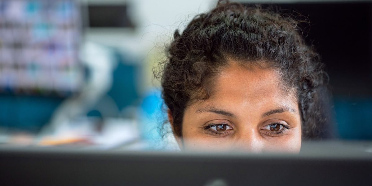 An individual focused on a task, representing the dedication required to successfully set up a professional email.