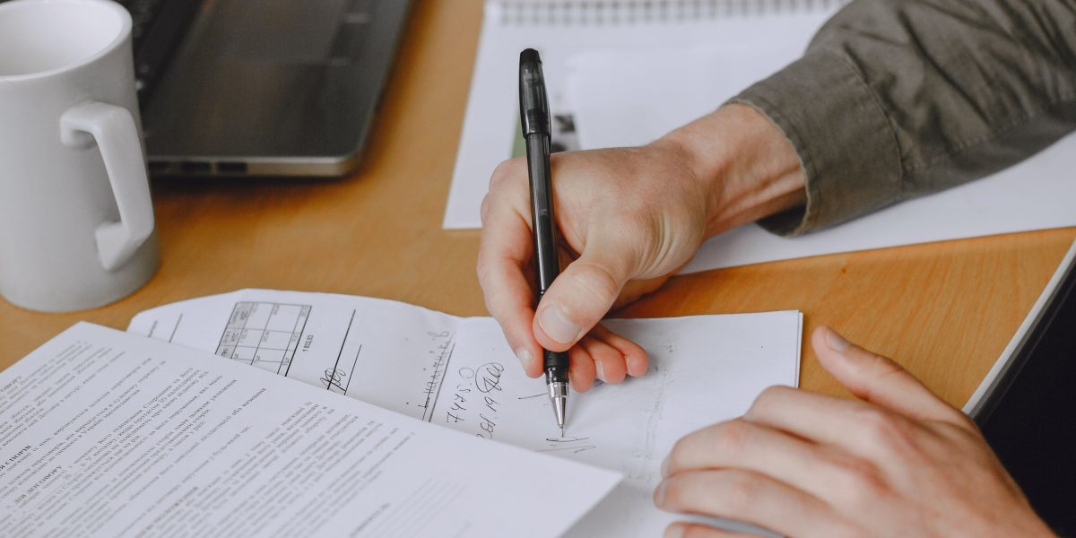 A professional carefully reviewing documents, symbolizing strategic decision-making based on historical knowledge.