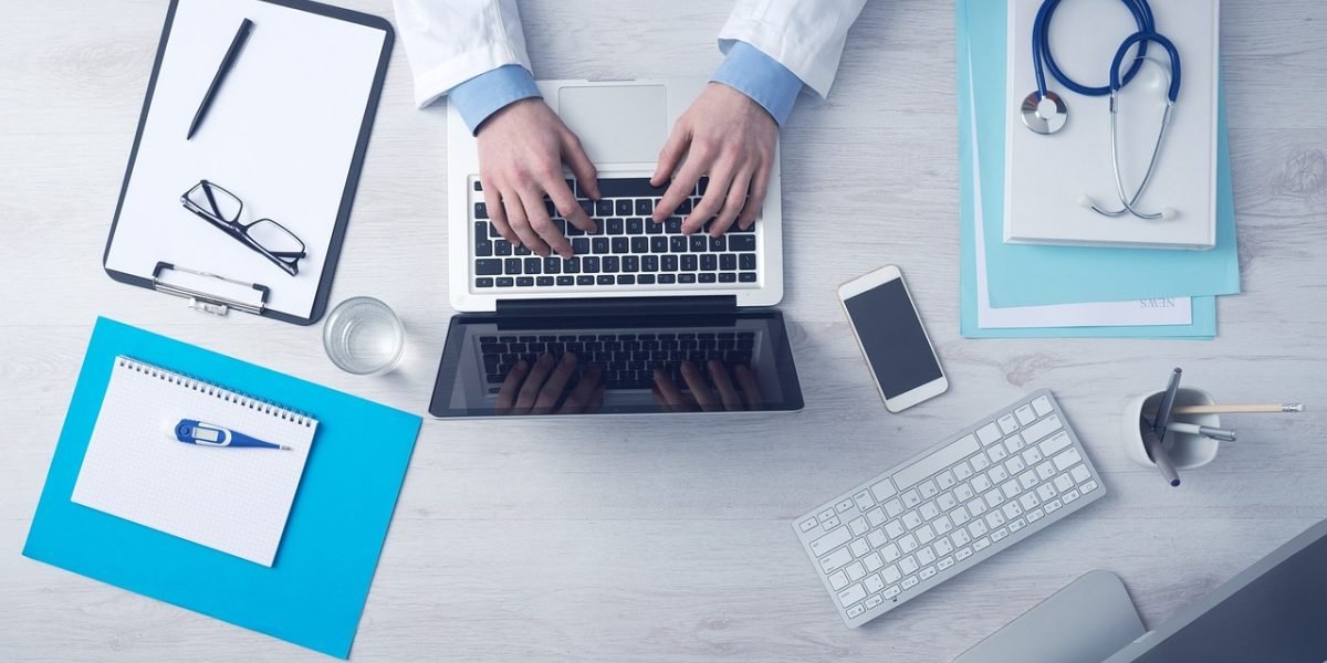 A professional organizing and prioritizing information to stay informed.