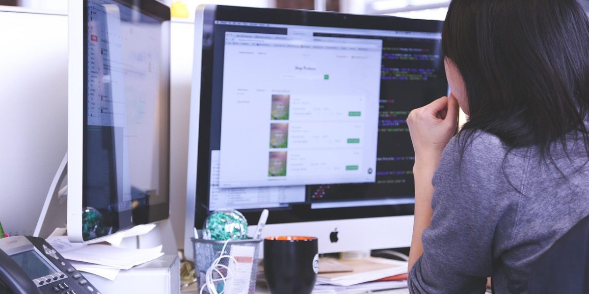 A professional carefully evaluating different aspects of a project to determine its true value and quality.