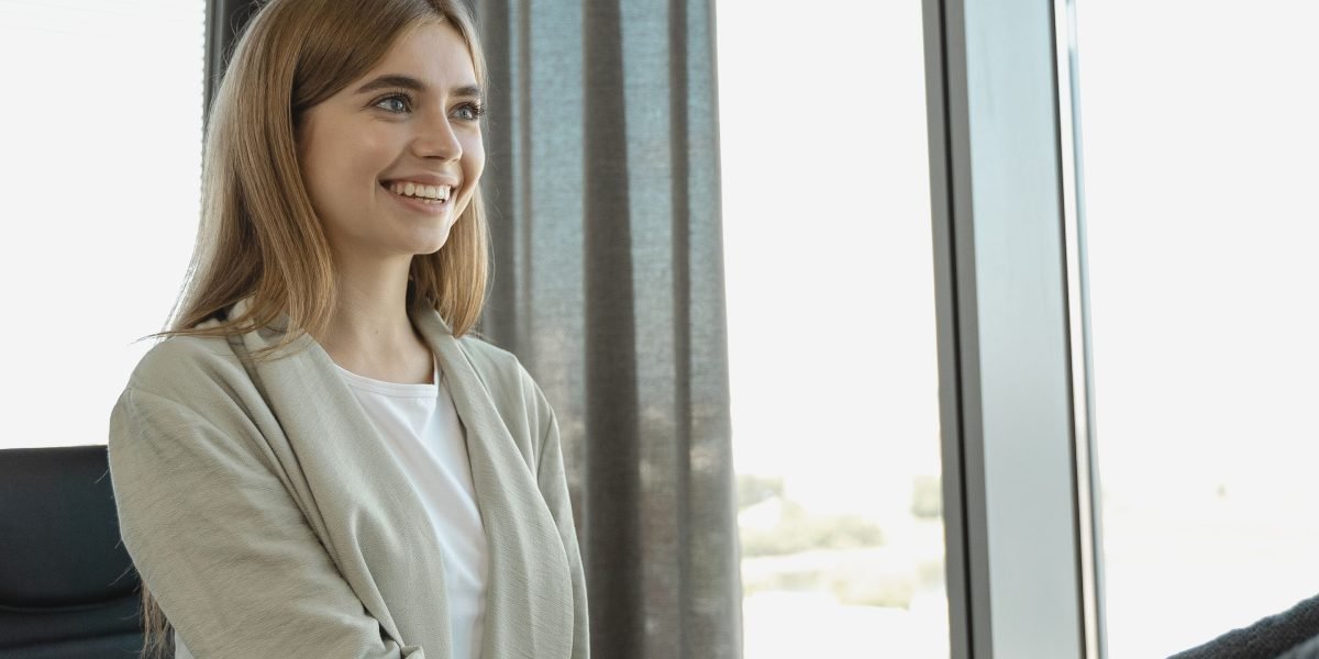 An interviewer and candidate engaged in a positive conversation, representing successful talent acquisition in tech.