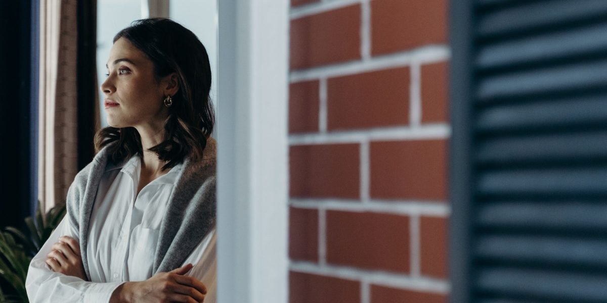 A person in deep thought, considering the best financial partner for their business.