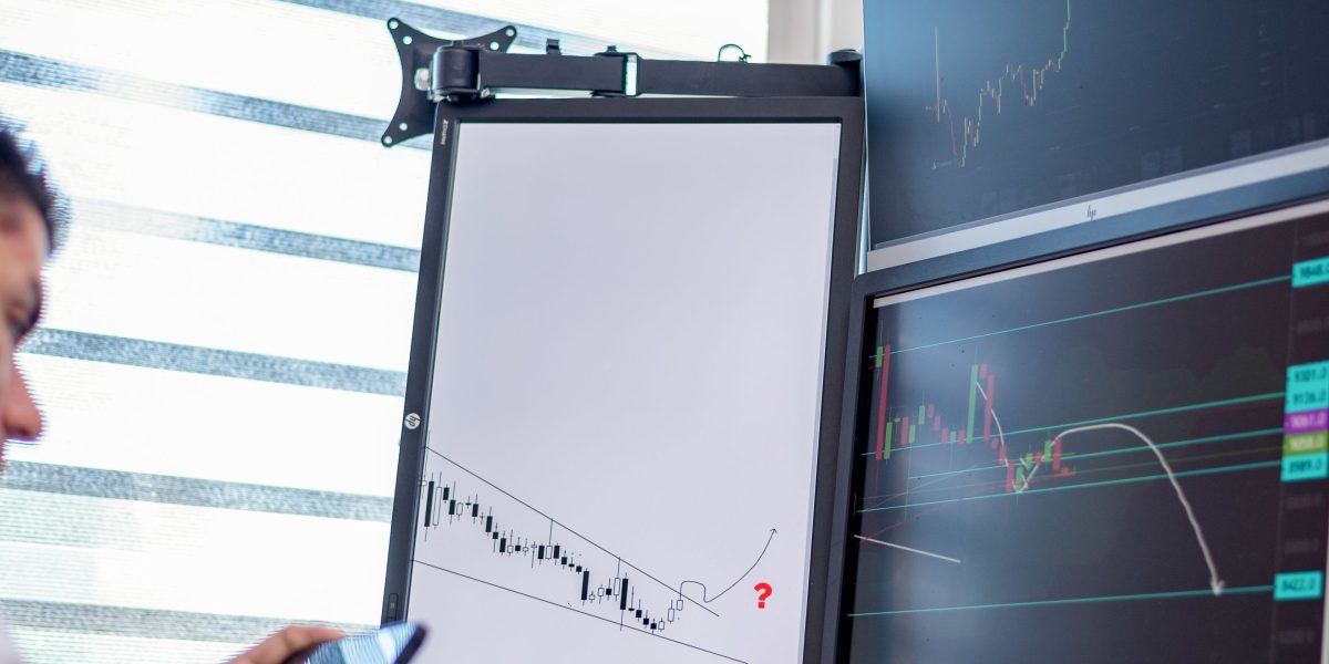 A focused investor evaluating market data and investment signals for emerging technologies like quantum AI.