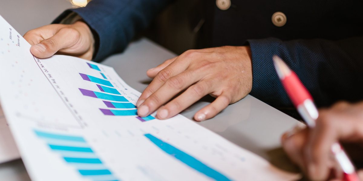 A professional analyzing investment documents, crucial for understanding PE firm portfolios.